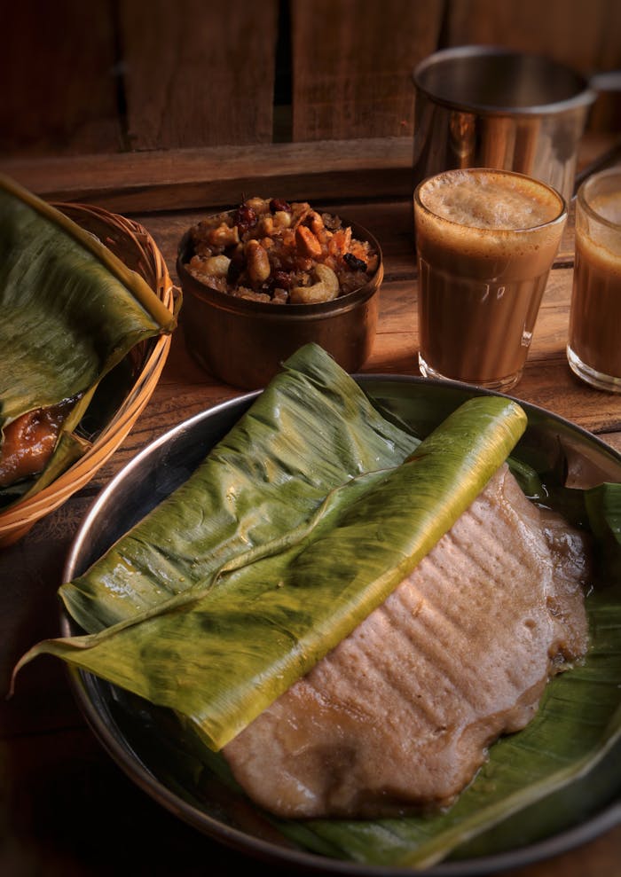Authentic South Indian breakfast served on banana leaf with chai.